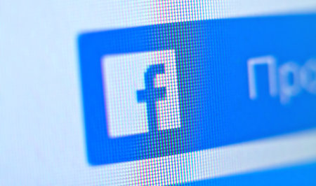 Facebook social media app logo on log-in, sign-up registration page on mobile app screen on smart...