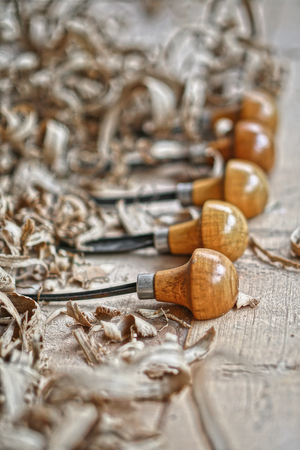 Woodworking and crafts tools. Carpentry hand tools. Planers, chisels, measuring tools.  lot of sawdust. Wooden background.の写真素材