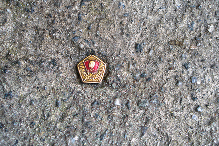 Photo of a red icon depicting Ulyanov Lenin. The coat of arms and the banner of the Soviet Union. USSR backgroundのeditorial素材