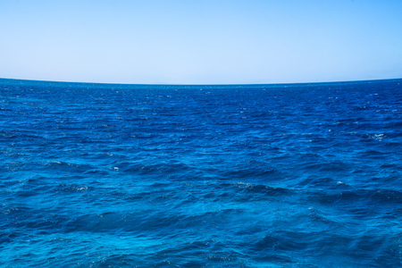 Beautiful blue sea surface with the sky. Oceanic deserted, lonely theme for background. Stock photo for tourist designの写真素材