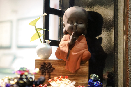 Buddha statuette with different accessories for prayer. Religious themeの写真素材