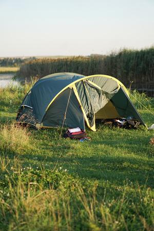 Landscape with a tent with a beautiful view near the river. Spring summer outdoor recreation. Stock background, photoの写真素材