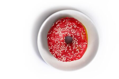 Beautiful juicy donut with a sweet cream.
Cupcake on white Background for kitchen design.の写真素材