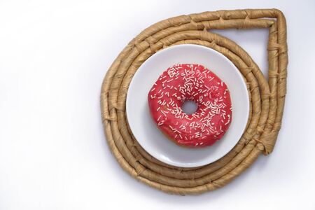 Beautiful juicy donut with a sweet cream.
Cupcake on white Background for kitchen design.の写真素材