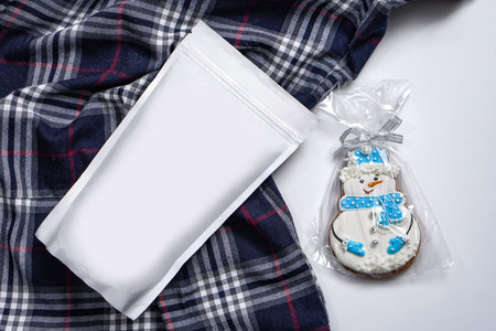 Template of paper ecological bag for storing coffee, tea with snowman-shaped cookies. Vacuum...