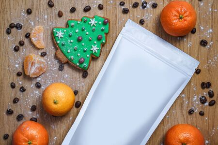 Template of paper ecological bag for storing coffee, tea with cookies in pines and tangerines. Vacuum packaging for christmas and new year presentの写真素材