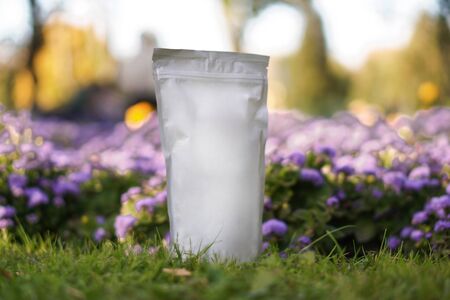 Paper-wrapped mocap for your logo or brand. pack of coffee, tea as a template for design. Box with a clean side. Against the background of natureの写真素材