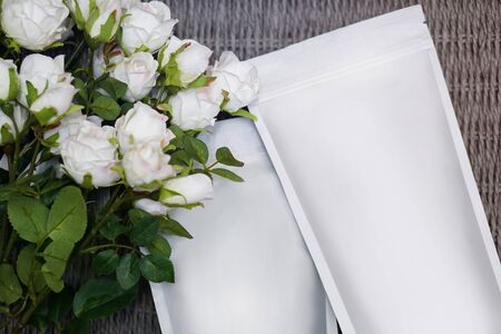 Beautiful spring bouquet with a pack of coffee for your decoration. Template for your brand on the packaging. Layout for the design of your logoの写真素材