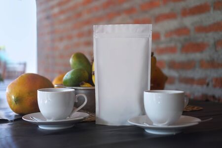 Mocap for your logo or brand. packaging of coffee, tea as a template for design. Box with a clean side. Travel theme still life with fruitの写真素材