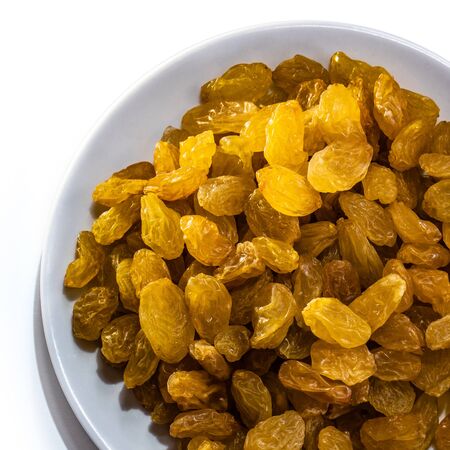 Raisins peeled on a white isolated background. Food grape yellow delicious for your design for the site. kitchen themeの写真素材