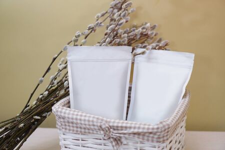 Beautiful spring bouquet with a pack of coffee for your decoration. Template for your brand on the packaging. Layout for the design of your logoの写真素材