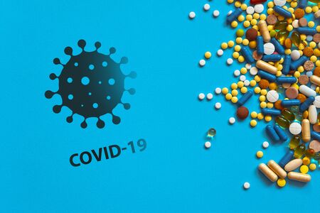 World pandemic with coronavirus and high mortality. Warning about the scary COVID-19 virus. Infections of Asia, Europe and America COVID19. Pills and rescue on backgroundの写真素材