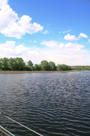Beautiful river in the highlands in summer. Lake in an ecologically clean park reserve on a background of hills. A pretty landscape in the spring. Stock photo for designの写真素材