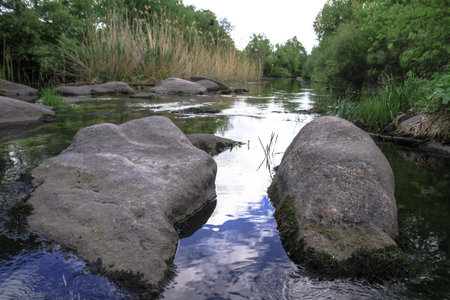 Beautiful river in the highlands in summer. Lake in an ecologically clean park reserve on a...