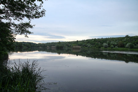 Beautiful river in the highlands in summer. Lake in an ecologically clean park reserve on a background of hills. A pretty landscape in the spring. Stock photo for designの写真素材