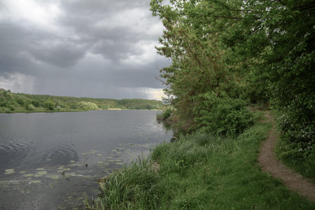 Beautiful river in a pretty area in Siberia. Landscape in Canada with a cold lake. Stock photo...