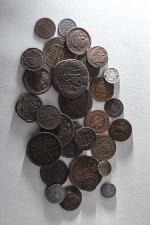 Ancient coins of the Russian Tsarist Empire. Collectible background on an isolated background! Numismatics of old money. Stock photo for designの写真素材