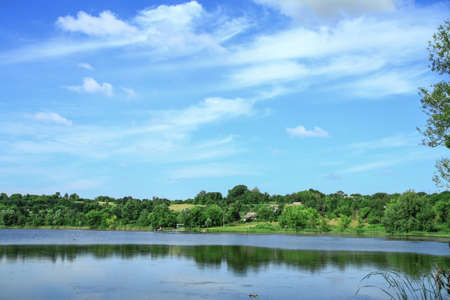 Beautiful river in a pretty area in Siberia. Landscape in Canada with a cold lake. Stock photo background.の写真素材