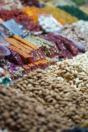 Rack on the market with dried fruits and nuts and Turkish sweets. Vegetarian food mix. Stock photo background for businessの写真素材