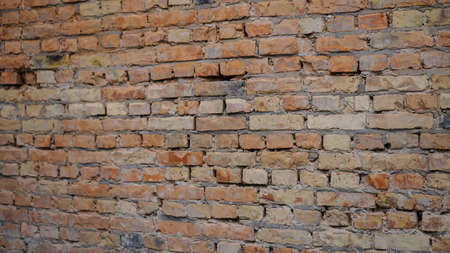 Red brick wall. Construction of a cheap interior. Grunge chernobyl backgroundの写真素材