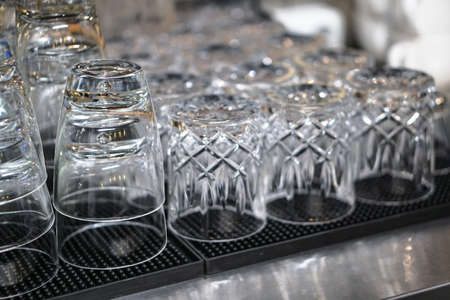 Clean washed glasses of dishes in the kitchen. Glasses for a large companyの写真素材
