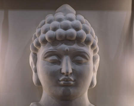 Sculpture of a bust of a Buddha. Eastern god in Buddhism. India and Sri Lanka beliefsの写真素材