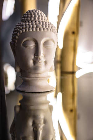 Sculpture of a bust of a Buddha. Eastern god in Buddhism. India and Sri Lanka beliefsの写真素材