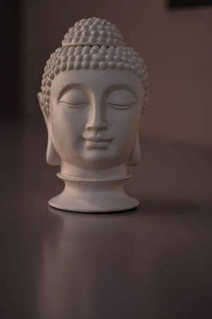 Sculpture of a bust of a Buddha. Eastern god in Buddhism. India and Sri Lanka beliefsの写真素材