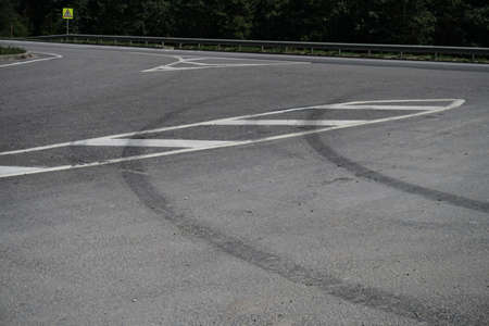 Tire marks on the asphalt. Good brakes and correct distance from the vehicle. Car safety themeの写真素材