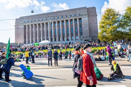 Helsinki, Finland - September 27 2019: Young students gather in climate change protest rally, School Strike 4 Climate, and demand urgent action on climate change.のeditorial素材