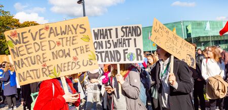 Helsinki, Finland - September 27 2019: Young students gather in climate change protest rally, School Strike 4 Climate, and demand urgent action on climate change.のeditorial素材