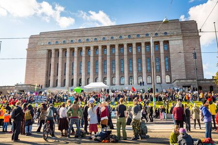 Helsinki, Finland - September 27 2019: Young students gather in climate change protest rally, School Strike 4 Climate, and demand urgent action on climate change.のeditorial素材