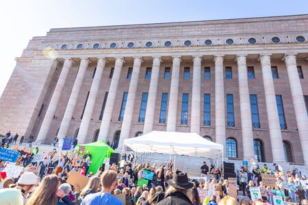 Helsinki, Finland - September 27 2019: Young students gather in climate change protest rally, School Strike 4 Climate, and demand urgent action on climate change.のeditorial素材