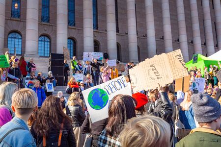 Helsinki, Finland - September 27 2019: Young students gather in climate change protest rally, School Strike 4 Climate, and demand urgent action on climate change.のeditorial素材