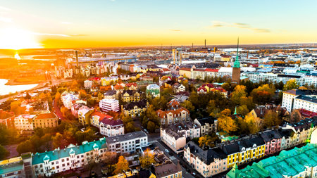 Aerial view of beautiful city Helsinki at sunset time. Blue sky and clouds and colorful buildings....