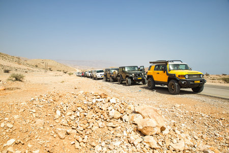 Oman. Circa April, 2019. A convoy of four wheel drive SUV cars make a stop on their way to a camping site.のeditorial素材