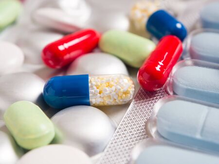Close-up red and blue pills.の写真素材