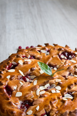 Homemade Cherry pie with almond on a light background, vertical.の写真素材