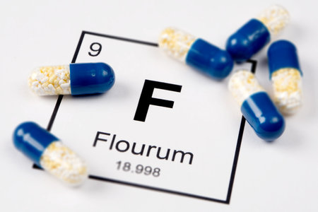 Pills with mineral Fe (Ferrum) on a white background with an inscription from the chemical table