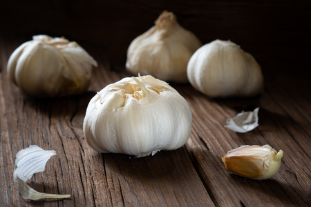 Garlic cloves on wooden background.の写真素材