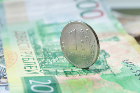 Russian coin one ruble on a banknote. Close-up.の写真素材