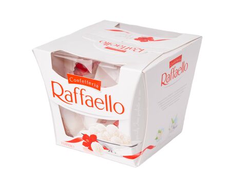 KHABAROVSK, RUSSIA - JUNE 28, 2018: Square box of sweets Rafaello - Crispy coconut with whole almond. Produced by the Italian company Ferrero.のeditorial素材