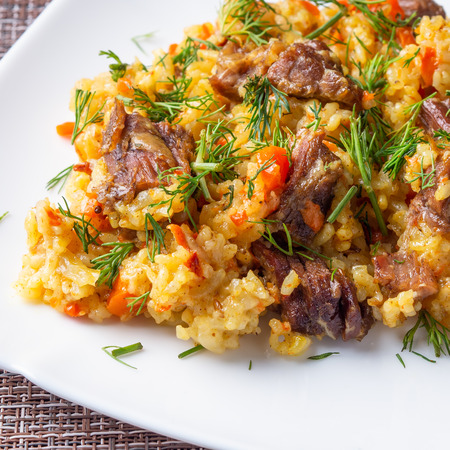 traditional pilaf on a white plateの写真素材