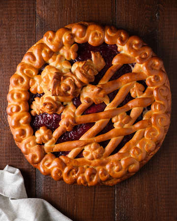 Piece of raspberry pie with ice cream on a light backgroundの写真素材