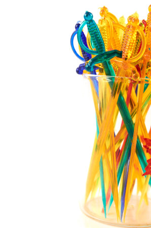 Colorful  plastic sticks for sandwiches in a glassの写真素材