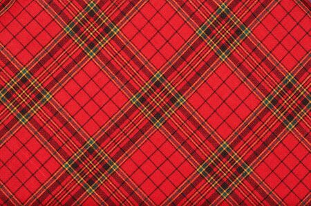 Textiles  Bright red plaid  fabric as natural backgroundの写真素材