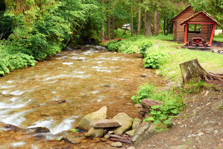 Swift mountain river in a picturesque forestの写真素材