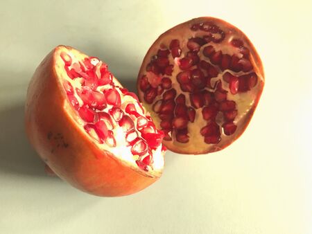 A ripe pomegranate in two piecesの素材