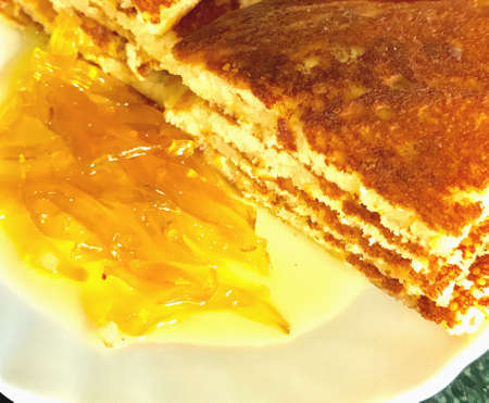 Slices of pancakes and jam in the plateの素材