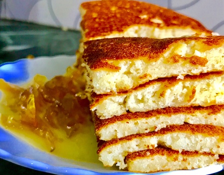 Slices of pancakes and jam in the plateの素材